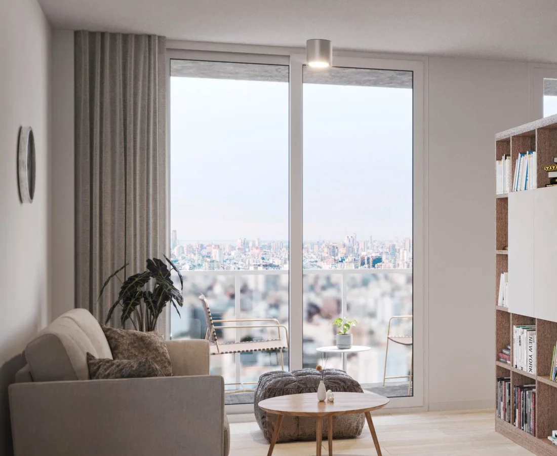 Ventanal de piso a techo de una unidad de Smart Point Villa Urquiza, con vista a la ciudad